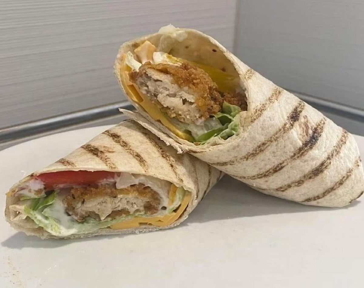 Toasted chicken wrap cut in half